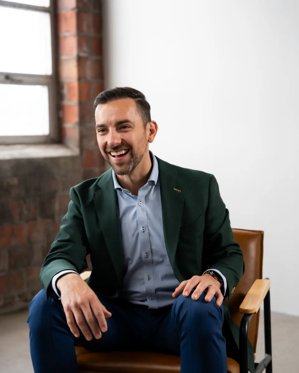 Chris Porpiglia, CFP®, seated and laughing during a conversation